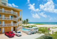 BEACHFRONT COMPLEX! STEPS FROM THE OCEAN!  HEATED POOL FULL KITCHEN FREE PARKING