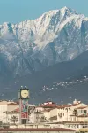 Fly in Viareggio beach in front of the famous promenade with shops and establishments - Mountain view