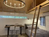 Modernized, renovated, cozy cottage steps away from a private beach.