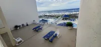 Cozy Beach Condo with Private Beach, heated pool, hot tub, and More.