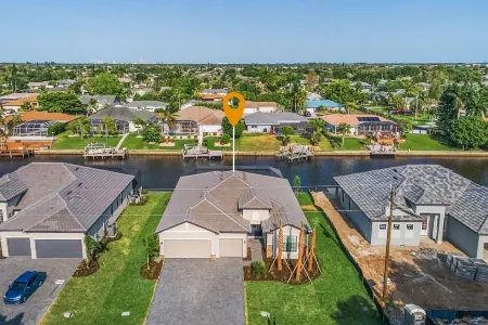 Great Location! 2,444 sq ft canal front villa with heated pool/spa.