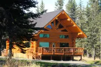 Unique Alaskan log home in trees & wild flowers on 14-acre private homestead.