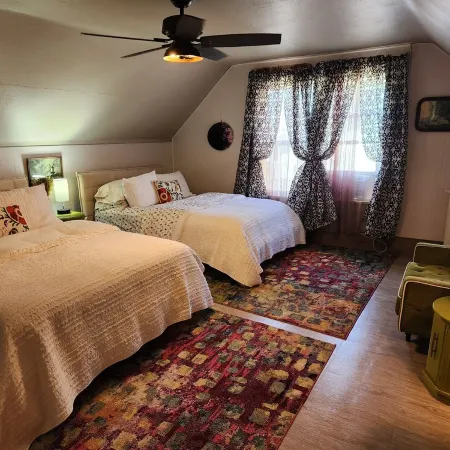 Enjoy the top floor of this victorian house With two suites & a bonus bedroom