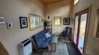 Tiny house on the prairie with mountain views.