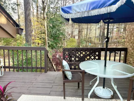 Cozy one level, 2 BR, 2 Bath TH in charming wooded community. Perfect location!