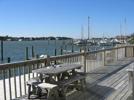 Waterfront Views and Private Deck - Charming Coastal Haven