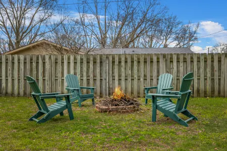 Charming Backyard Oasis with Fire Pit and Rec Room - Inviting Getaway