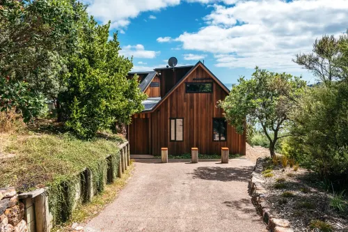 Designer living with stunning views across the bay, a spa and coast walks.