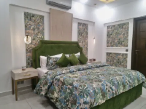 Zaha Homes-Grand 3BR apt by SNL, Shaheed-e-Millat Road Hotels in 