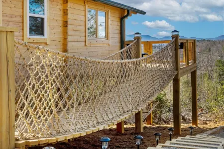 Romantic Treehouse with Hot Tub, Waterfall, Hiking, Swinging Bridge & Goats