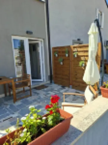 Newly built and decorated cute studio with a terrace overlooking the garden.