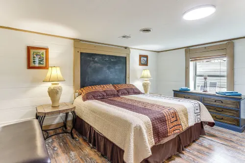 Deck & Yard: Wolf Creek Waterfront Home in Grove! - 3-Star