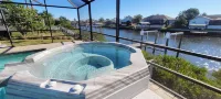 Seaside Oasis! Dog-Friendly, Waterfront, Private Dock, Saltwater Pool & Spa,