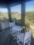 Three-bedroom house with views, decks, golf cart and home gym!