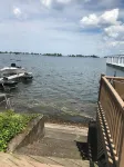 Charming Cottage on the Bay and Golf Course with private patio and boat dock.
