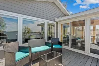 Cozy, year-round lake home with magnificent sunset views, lake access and dock.