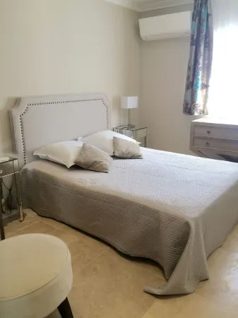 Air-conditioned apartment with large terrace on property with swimming pool