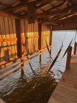Peaceful lake front home with wrap around porch and relaxing views!