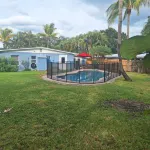 Lagoon shaped pool home with private back yard!