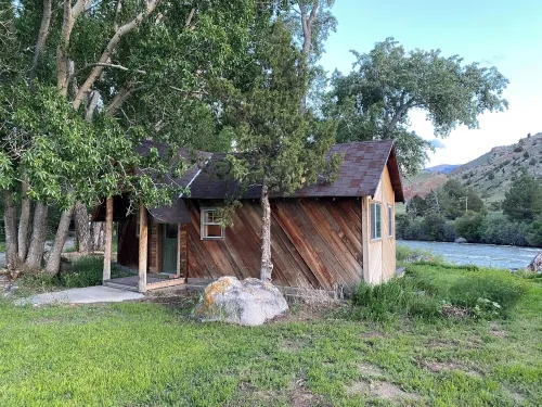Remodeled Cabin on 40 private acres of Wind River frontage with R/V hookup.
