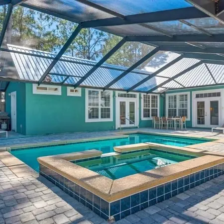 Private 5-bedroom house with private screened in pool and beach access