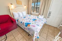 Private Balcony and Sparkling Pool - Charming Coastal Retreat Hotels near Beach Bookshop & Video