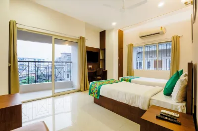 Treebo Urban Oasis Inn, Sixmile Hotels in 