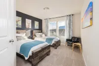 3-bedroom townhome with 2 Car Garage, EV Charger, WiFi, AC, Fitness Room