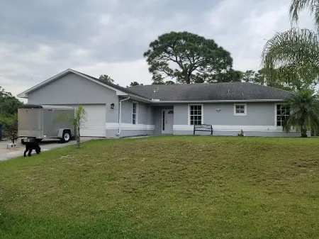 Spacious 4-bedroom house in peaceful Lehigh Acres with WiFi, AC. Newly remodeled