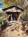 Historic Cabin in a natural setting with waterfalls and covered bridge