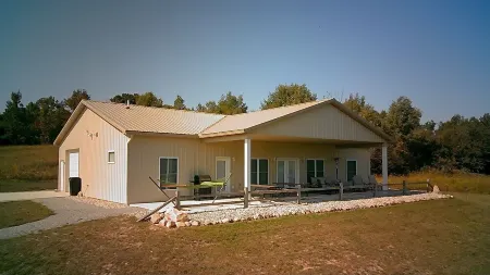 Brand New Barndominium on 40 Acres with Private Lake
