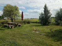 Holiday house with a large garden and swimming lake in the village