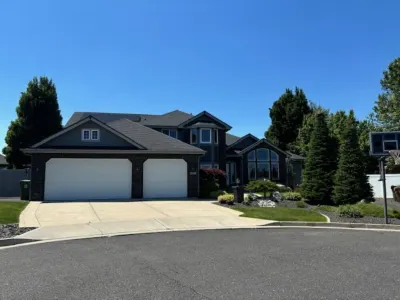 Gorgeous 6-bedroom home with theater, spa and gym, and more, on parklike grounds