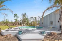 Luxury riverfront home w/ pool, fishing dock, & boat house w/ lift ! Sleeps 14