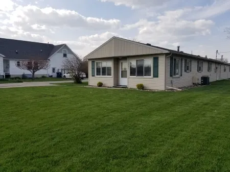 Open concept 2 bedroom ranch with attached garage and deck