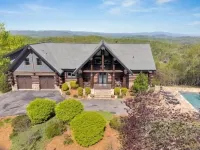 5500 sf cabin: 6 king/2 queen beds, heated pool/spa, game room, mountain views