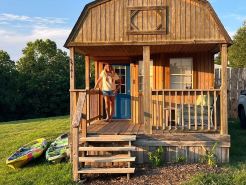 The Little Sugar Shack, a rustic tiny cabin with hot tub access & fiery sunsets!