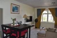 2-bedroom Gated Oasis with parking andPool