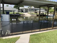 Waterfront, indoor pool, covered marina, fenced 3/2 home