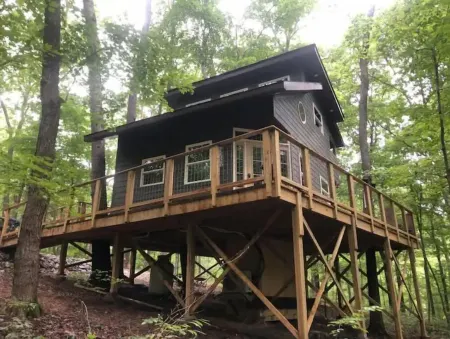 Secluded treehouse with indoor fireplace