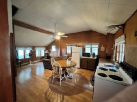 Charming 2-bedroom cabin sits on 2.5 acres on Hubbard Lake.