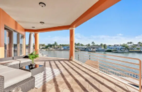 Indulge in Luxury at This Expansive Three-Story Waterfront Retreat.