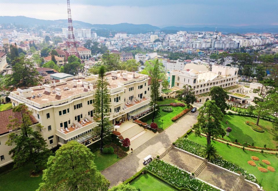 Dalat Palace Heritage Hotel 1922 French colonial facade and lakefront gardens
