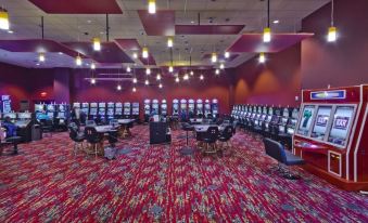 a large room filled with multiple video game consoles and gaming consoles , ready for a gaming event at Shoshone Rose Casino & Hotel