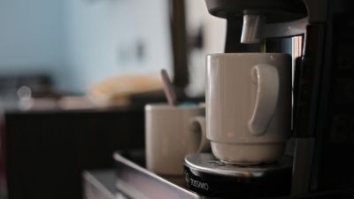 a coffee maker is placed on a kitchen counter , ready to be used for brewing at Village Hotel Liverpool