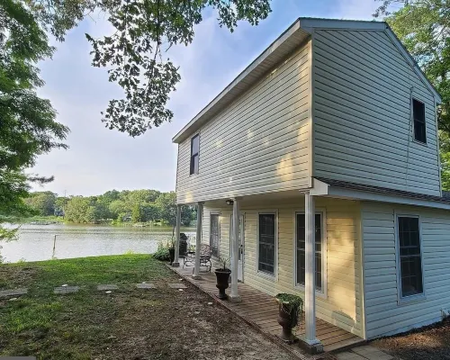 Private Riverfront Home with dock Hotels in Cople