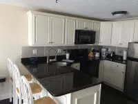 Relax and get away! Beautiful upscale condo with pool near OGT Village and Beach