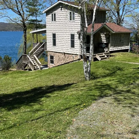 Lakefront cottage with private deck and dock, amazing porch with sunset views