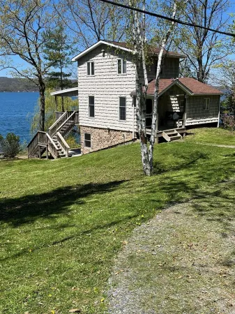Lakefront cottage with private deck and dock, amazing porch with sunset views
