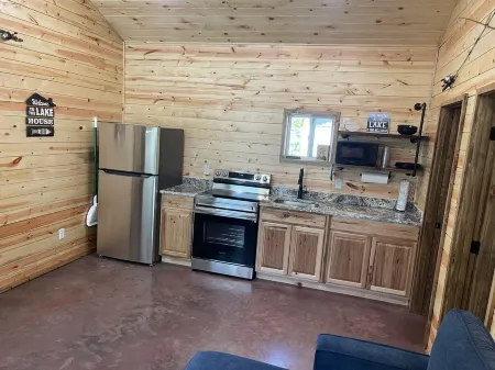Lake view 2 bedroom cabin that sleeps 6. Private deck and fire pit area.
